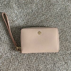 Used Tory Burch light pink wristlet approximately 6x4.